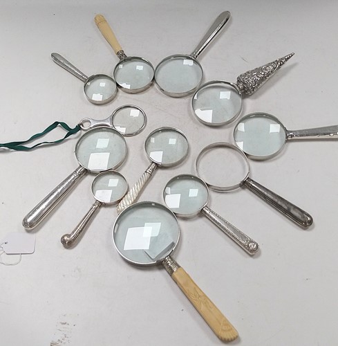 Lot 353 - A collection of 12 magnifying glasses, many...