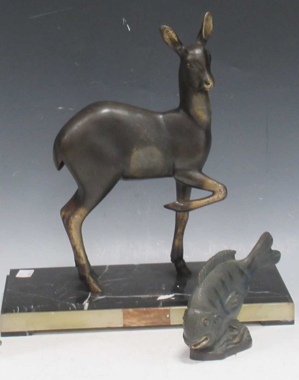 Lot 76 - An Art Deco sculpture of a fawn, brass,...