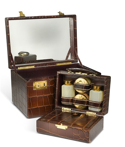 Lot 147 - Saks Fifth Avenue, a vintage crocodile grained leather vanity case