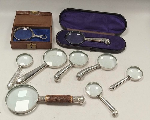 Lot 348 - A collection of 9 magnifying glasses, two...