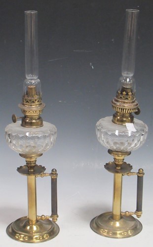 Lot 104 - A pair of late Victorian hand held brass oil...