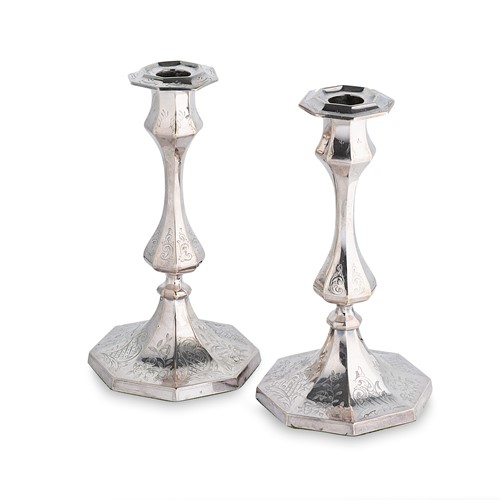 Lot 374 - A pair of mid 19th century silver plated candlesticks