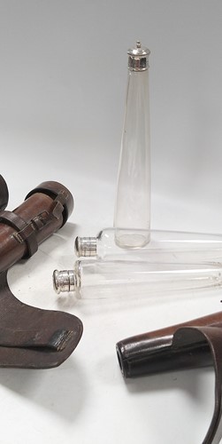 Lot 343 - A trio of glass hunting flasks, one silver...