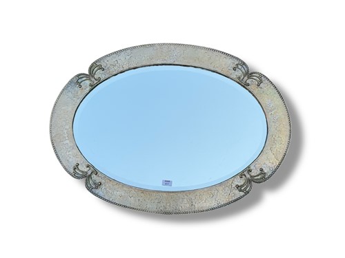 Lot 817 - A silver plated repousse oval mirror with...