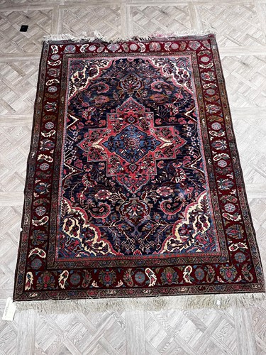 Lot 863 - A Feraghan wool rug, the blue ground floral...