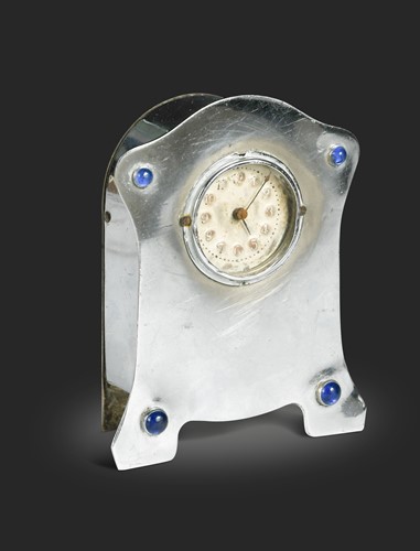 Lot 164 - In the manner of Liberty & Co., a small chromed mantel clock