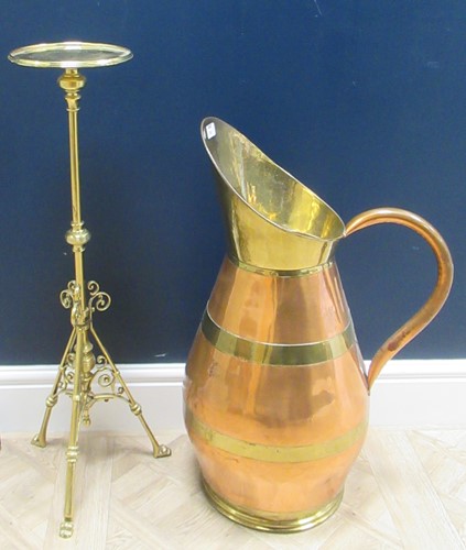 Lot 250 - A very large brass banded copper ewer or jug,...