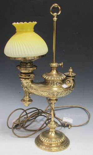 Lot 190 - An adjustable brass lamp with lemon yellow...