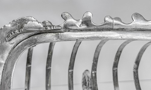Lot 447 - A George III silver 7 bar toast rack