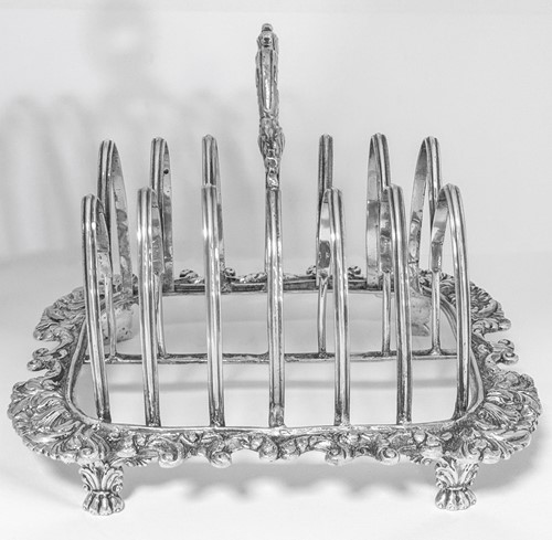 Lot 447 - A George III silver 7 bar toast rack