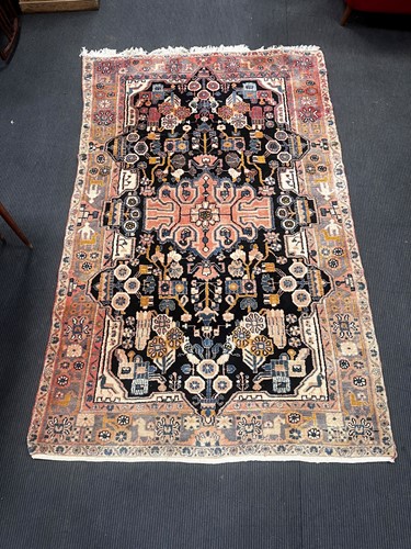 Lot 880 - A Nahavand rug, the blue ground with central...