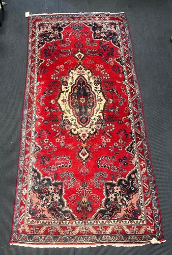 Lot 876 - A Hamadan rug with lozenge shaped medallion on...