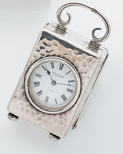Lot 343 - An early 20th century silver boudoir clock