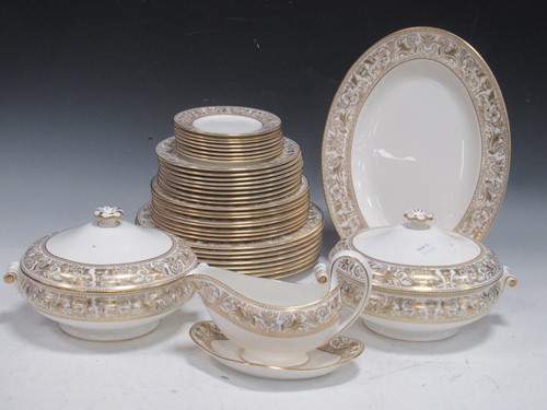 Lot 121 - Wedgwood 'Gold Florentine' pattern dinner...