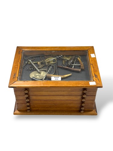 Lot 406 - A small cabinet containing cork screws etc