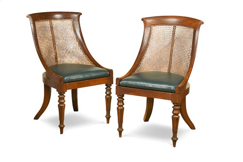Lot 552 - A pair of Regency bergère library chairs