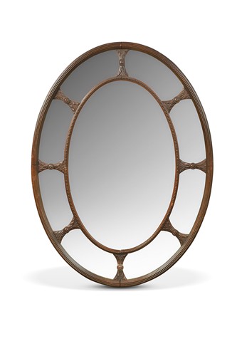 Lot 643 - A mahogany oval wall mirror, late 19th century