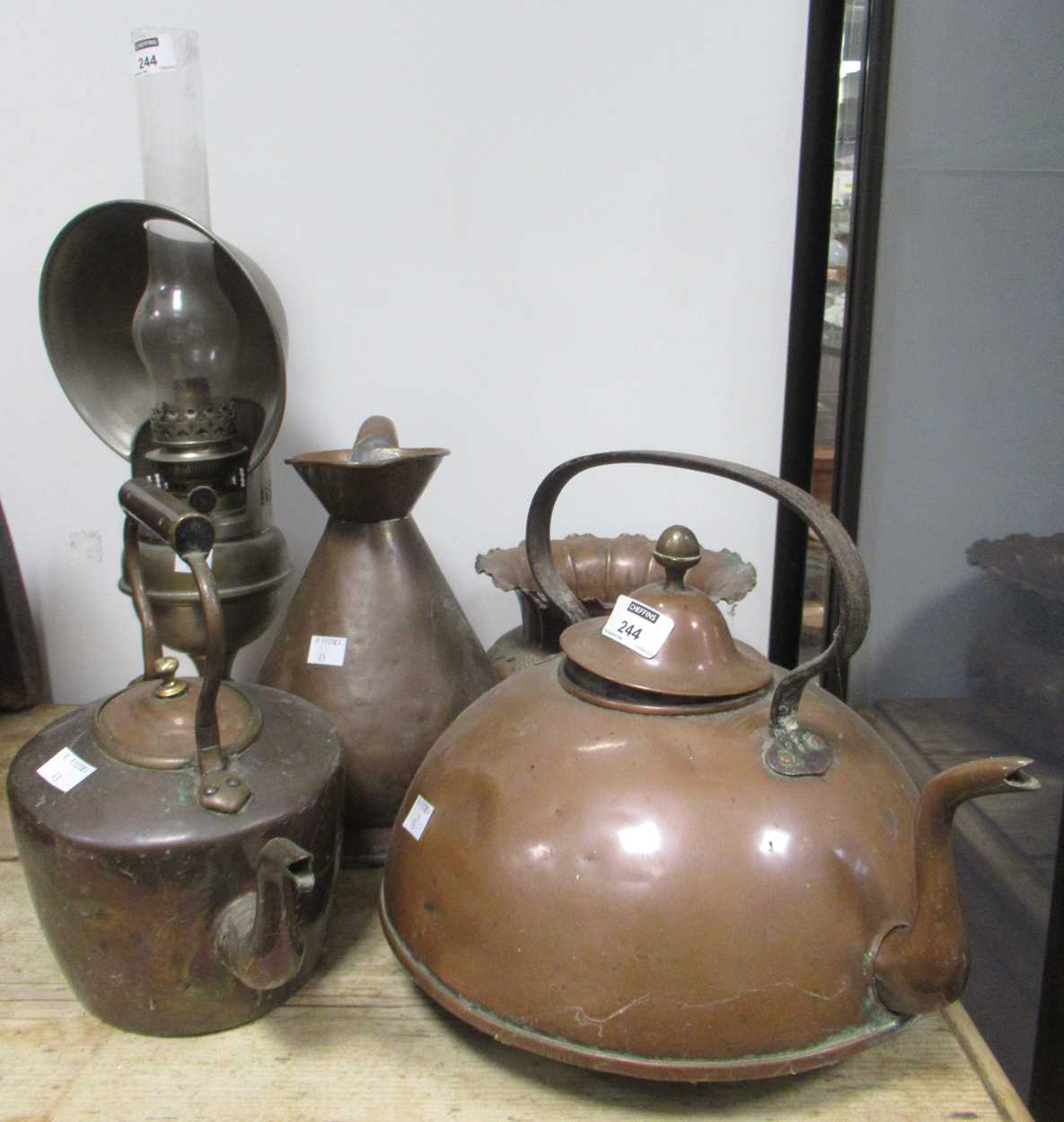 Lot 244 - A copper kettle, another, a half-gallon copper...