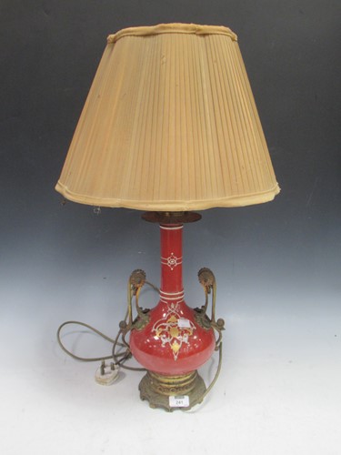 Lot 241 - A late Victorian or Edwardian lamp with red...