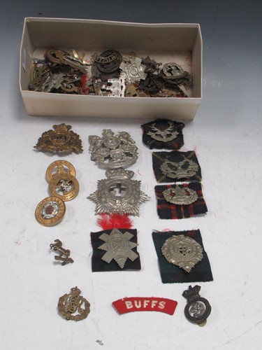 Lot 185 - A quantity of Military badges including a...