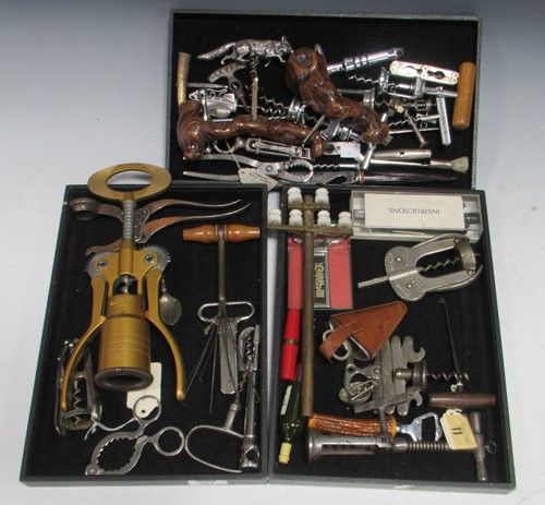 Lot 184 - A collection of corkscrews including a brass...