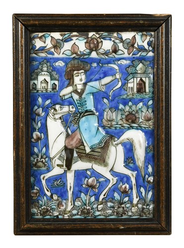 Lot 730 - A Persian Qajar moulded rectangular tile, 19th century