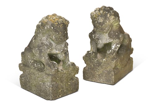 Lot 734 - A pair of carved stone Foo dogs, 20th century