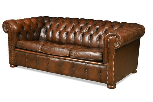 Lot 655 - A leather three-seat chesterfield sofa, modern