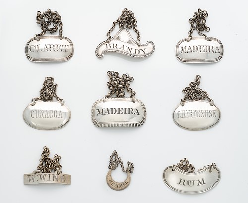 Lot 348 - A collection of 9 George III and later silver bottle labels
