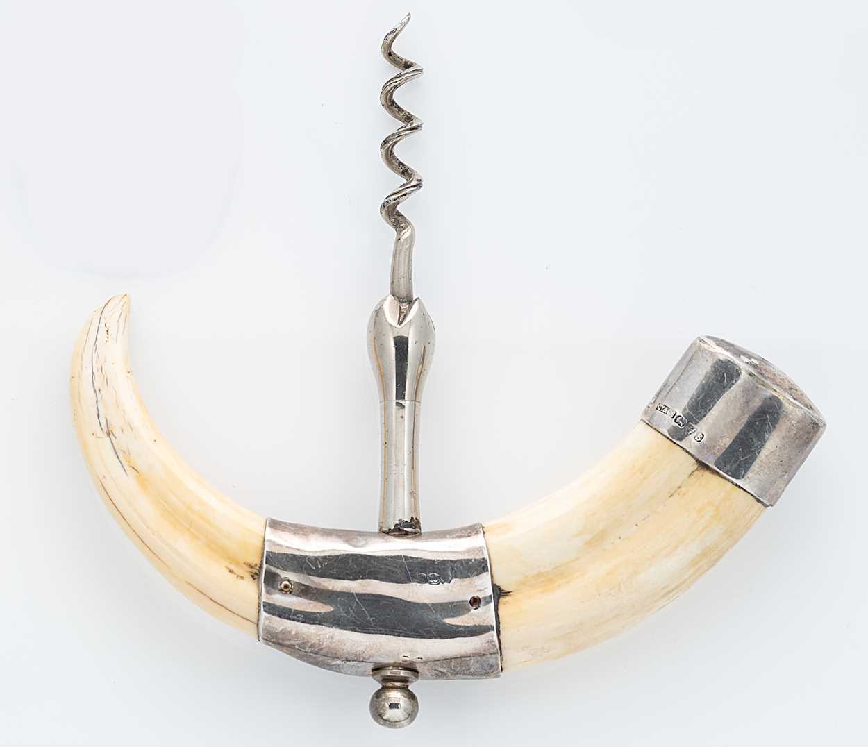 Lot 308 - An early 20th century silver and tusk corkscrew, retailed by Asprey