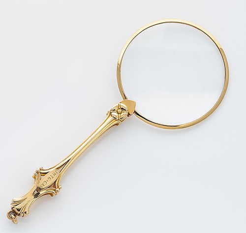 Lot 324 - An American metalwares folding magnifying glass, marked Tiffany