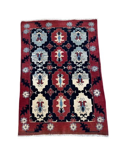 Lot 668 - A Turkish rug, with three rows of four...