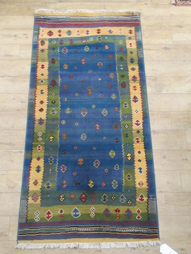 Lot 868 - Two modern tribal style rugs, 190 x 93cm and...