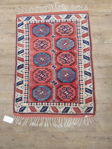 Lot 870 - A hand-knotted caucasian style rug, 156 x 96cm