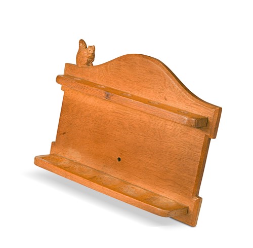 Lot 126 - Wilf 'Squirrelman' Hutchinson (1936-2013), an oak wall-mounted spoon or pipe rack