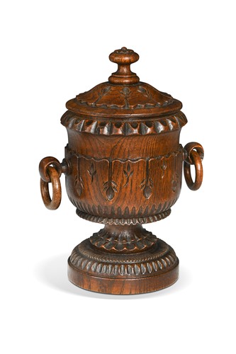 Lot 563 - A William IV turned and carved oak tobacco jar