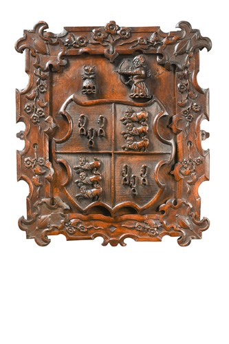 Lot 407 - A carved fruitwood family armorial, 19th century