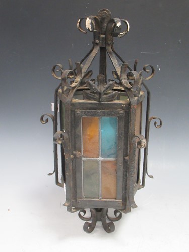 Lot 621 - A small hall lantern, black painted scrolling...