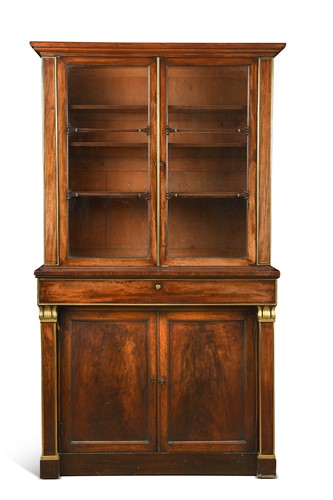 Lot 659 - A Continental mahogany secretaire bookcase, early 19th century