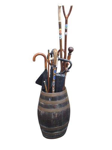 Lot 160 - An oak brass bound barrel pattern stick stand,...