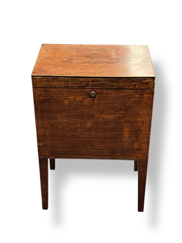 Lot 602 - A Georgian mahogany cellarette, the interior...