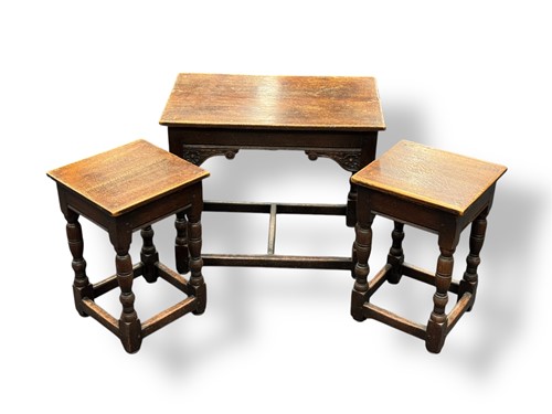 Lot 607 - An oak nest of three tables in the antique...
