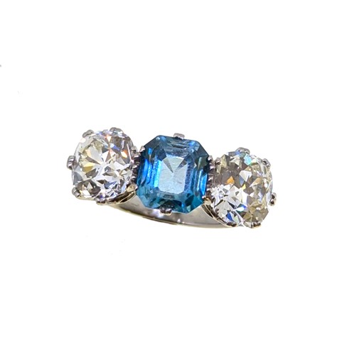 Lot 202 - A zircon and diamond three stone ring