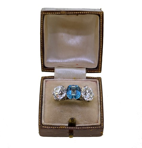 Lot 202 - A zircon and diamond three stone ring
