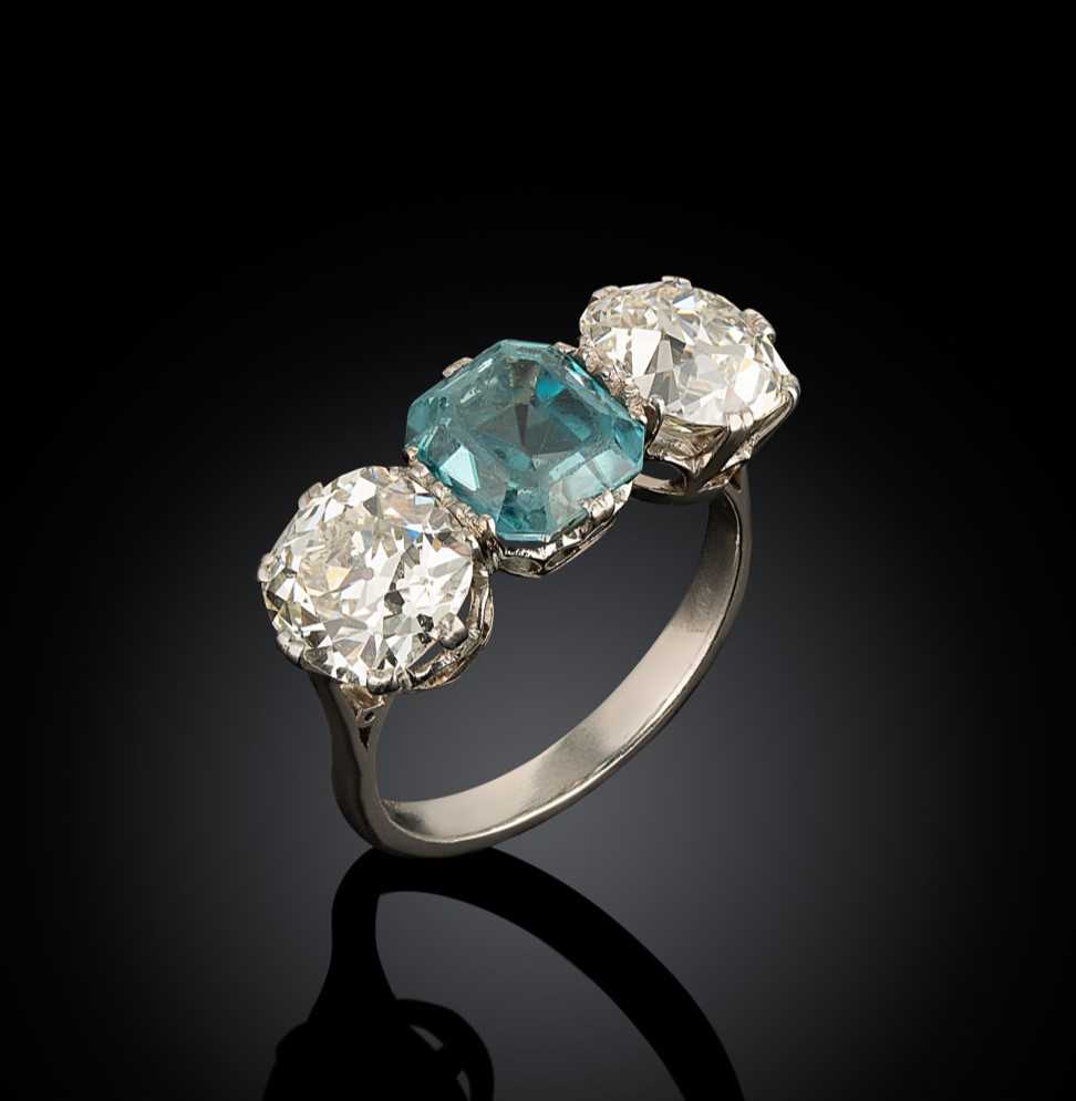 Lot 202 - A zircon and diamond three stone ring