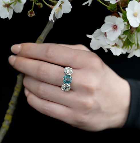 Lot 202 - A zircon and diamond three stone ring