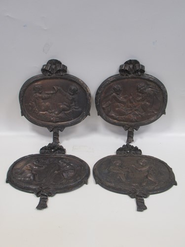 Lot 184 - A set of four bronzed metal plaques of the...