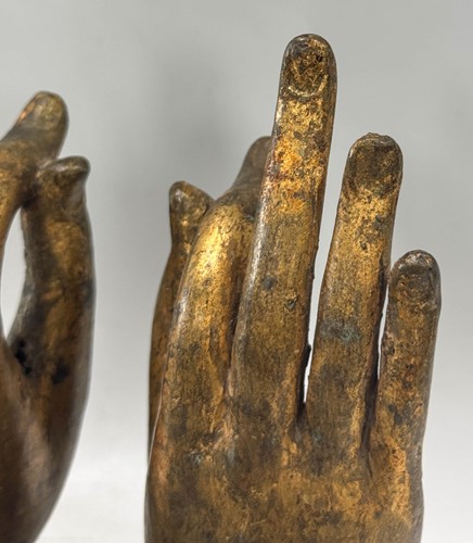 Lot 97 - A pair of Tibetan gilt bronze Buddha hands, 19th century