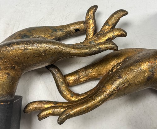 Lot 97 - A pair of Tibetan gilt bronze Buddha hands, 19th century