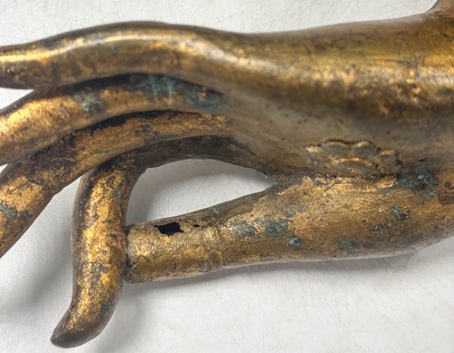 Lot 97 - A pair of Tibetan gilt bronze Buddha hands, 19th century